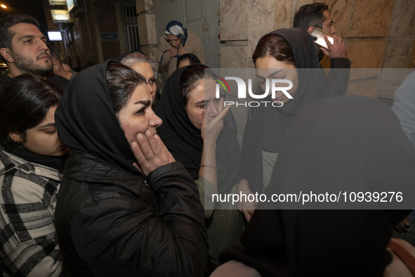 Relatives of a patient are gathering at the site of the fire at the Gandhi Hotel Hospital in northern Tehran, Iran, on January 25, 2024. Pat...