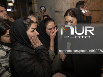 Relatives of a patient are gathering at the site of the fire at the Gandhi Hotel Hospital in northern Tehran, Iran, on January 25, 2024. Pat...