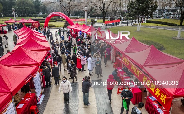 Job seekers are consulting at a job fair in Hefei, China, on January 26, 2024. 