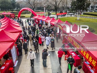 Job seekers are consulting at a job fair in Hefei, China, on January 26, 2024. (