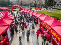 Job seekers are consulting at a job fair in Hefei, China, on January 26, 2024. (