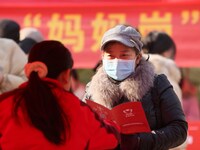 Job seekers are consulting at a job fair in Hefei, China, on January 26, 2024. (