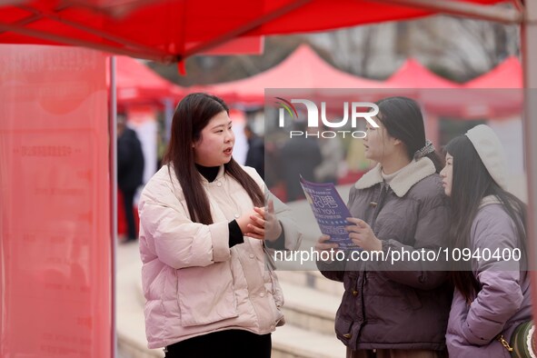 Job seekers are consulting at a job fair in Hefei, China, on January 26, 2024. 