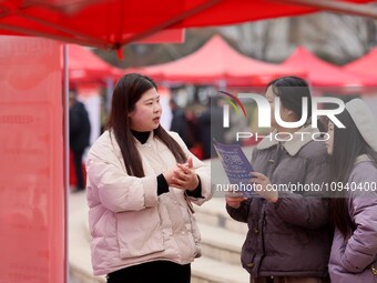 Job seekers are consulting at a job fair in Hefei, China, on January 26, 2024. (