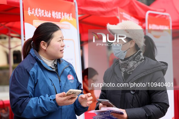 Job seekers are consulting at a job fair in Hefei, China, on January 26, 2024. 