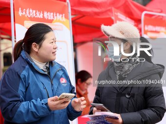 Job seekers are consulting at a job fair in Hefei, China, on January 26, 2024. (