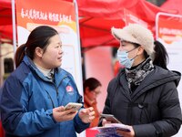 Job seekers are consulting at a job fair in Hefei, China, on January 26, 2024. (