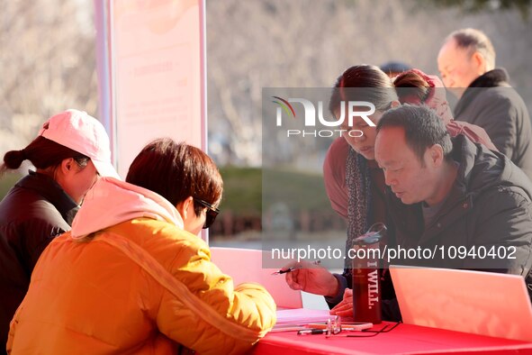 Job seekers are consulting at a job fair in Hefei, China, on January 26, 2024. 