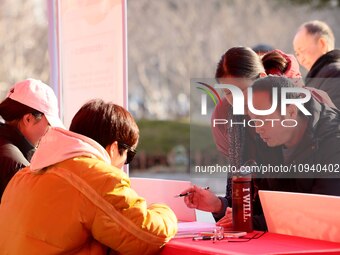 Job seekers are consulting at a job fair in Hefei, China, on January 26, 2024. (