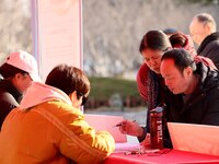 Job seekers are consulting at a job fair in Hefei, China, on January 26, 2024. (