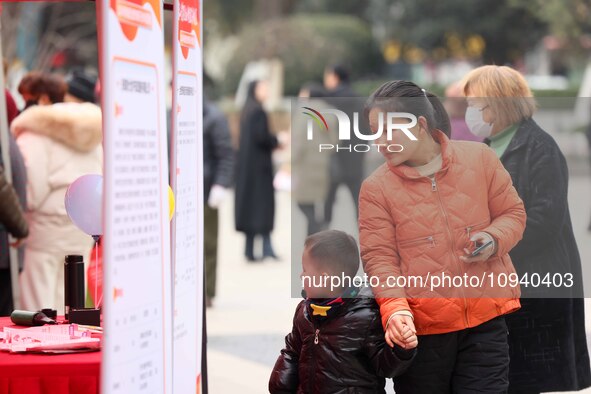 Job seekers are consulting at a job fair in Hefei, China, on January 26, 2024. 