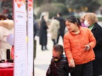 Job seekers are consulting at a job fair in Hefei, China, on January 26, 2024. (