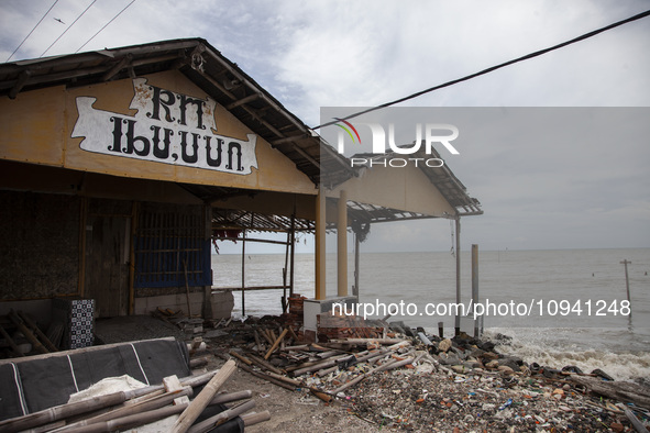 An abandoned restaurant building is being destroyed by high waves in Cemarajaya Village, Karawang Regency, West Java Province, on January 26...