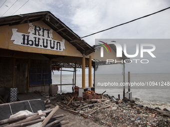 An abandoned restaurant building is being destroyed by high waves in Cemarajaya Village, Karawang Regency, West Java Province, on January 26...