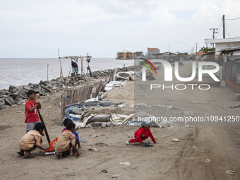 Children are playing on the village street right on the beach in Cemarajaya Village, Karawang Regency, West Java Province, on January 26, 20...