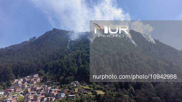 An aerial view is showing thick columns of smoke from the forest fires in the eastern hills of Bogota, Colombia. 