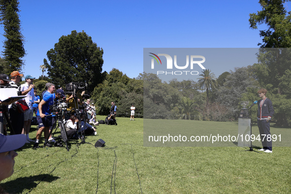 Jannik Sinner of Italy is speaking with the Norman Brookes Challenge Cup after winning the 2024 Australian Open Final at the Royal Botanic G...