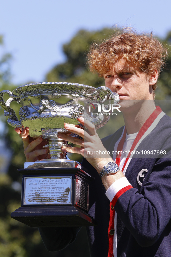 Jannik Sinner of Italy is posing with the Norman Brookes Challenge Cup after winning the 2024 Australian Open Final at the Royal Botanic Gar...