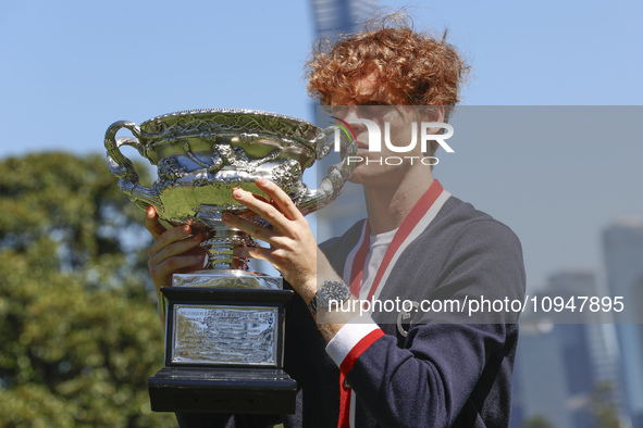 Jannik Sinner of Italy is posing with the Norman Brookes Challenge Cup after winning the 2024 Australian Open Final at the Royal Botanic Gar...