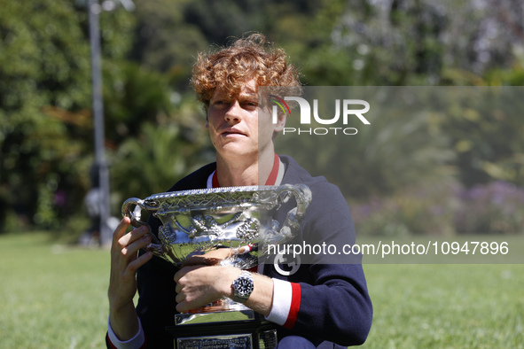 Jannik Sinner of Italy is posing with the Norman Brookes Challenge Cup after winning the 2024 Australian Open Final at the Royal Botanic Gar...