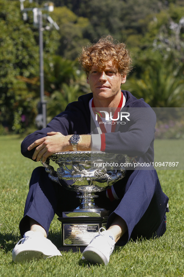 Jannik Sinner of Italy is posing with the Norman Brookes Challenge Cup after winning the 2024 Australian Open Final at the Royal Botanic Gar...