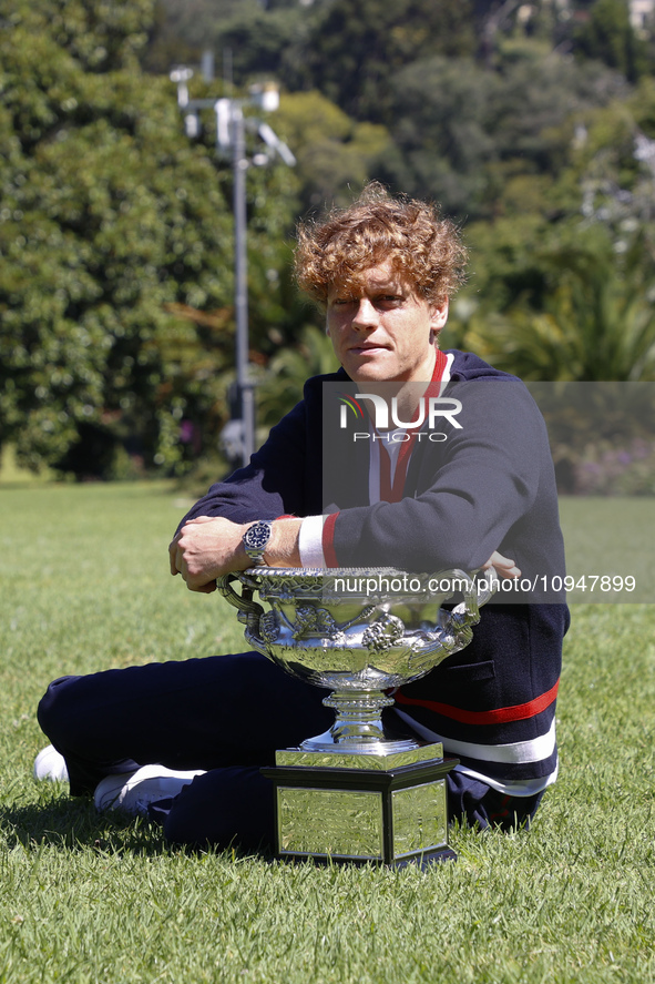 Jannik Sinner of Italy is posing with the Norman Brookes Challenge Cup after winning the 2024 Australian Open Final at the Royal Botanic Gar...