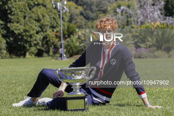 Jannik Sinner of Italy is posing with the Norman Brookes Challenge Cup after winning the 2024 Australian Open Final at the Royal Botanic Gar...