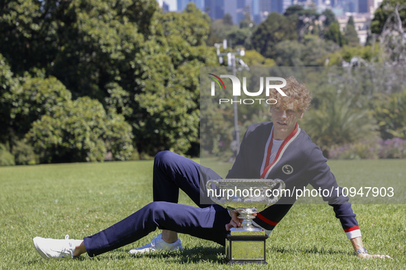 Jannik Sinner of Italy is posing with the Norman Brookes Challenge Cup after winning the 2024 Australian Open Final at the Royal Botanic Gar...