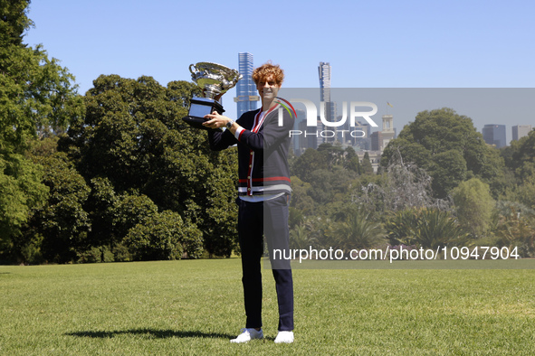 Jannik Sinner of Italy is posing with the Norman Brookes Challenge Cup after winning the 2024 Australian Open Final at the Royal Botanic Gar...