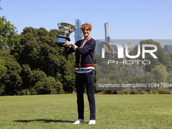 Jannik Sinner of Italy is posing with the Norman Brookes Challenge Cup after winning the 2024 Australian Open Final at the Royal Botanic Gar...