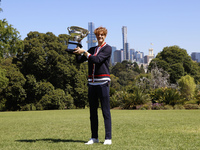 Jannik Sinner of Italy is posing with the Norman Brookes Challenge Cup after winning the 2024 Australian Open Final at the Royal Botanic Gar...