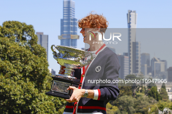 Jannik Sinner of Italy is posing with the Norman Brookes Challenge Cup after winning the 2024 Australian Open Final at the Royal Botanic Gar...