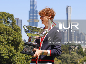 Jannik Sinner of Italy is posing with the Norman Brookes Challenge Cup after winning the 2024 Australian Open Final at the Royal Botanic Gar...