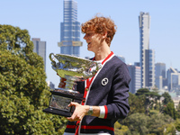 Jannik Sinner of Italy is posing with the Norman Brookes Challenge Cup after winning the 2024 Australian Open Final at the Royal Botanic Gar...