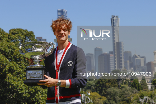 Jannik Sinner of Italy is posing with the Norman Brookes Challenge Cup after winning the 2024 Australian Open Final at the Royal Botanic Gar...