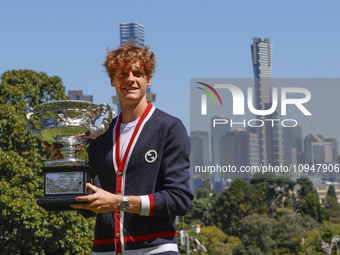 Jannik Sinner of Italy is posing with the Norman Brookes Challenge Cup after winning the 2024 Australian Open Final at the Royal Botanic Gar...