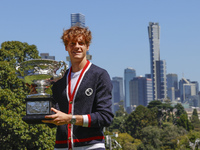 Jannik Sinner of Italy is posing with the Norman Brookes Challenge Cup after winning the 2024 Australian Open Final at the Royal Botanic Gar...