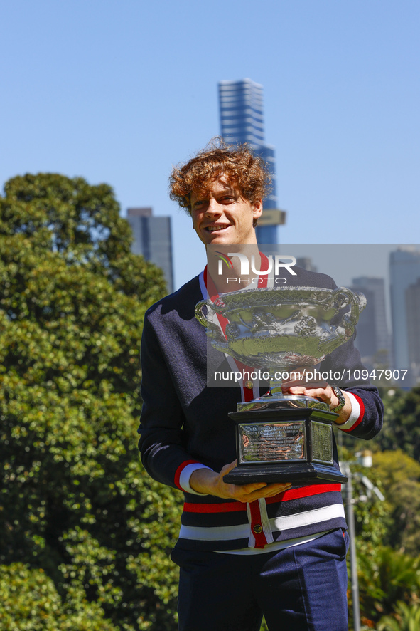 Jannik Sinner of Italy is posing with the Norman Brookes Challenge Cup after winning the 2024 Australian Open Final at the Royal Botanic Gar...