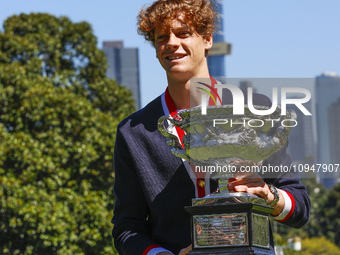 Jannik Sinner of Italy is posing with the Norman Brookes Challenge Cup after winning the 2024 Australian Open Final at the Royal Botanic Gar...