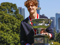 Jannik Sinner of Italy is posing with the Norman Brookes Challenge Cup after winning the 2024 Australian Open Final at the Royal Botanic Gar...