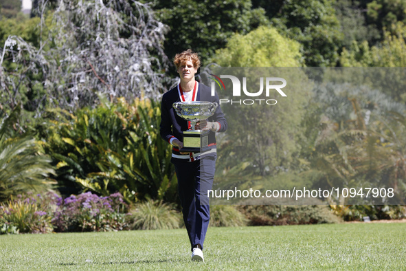 Jannik Sinner of Italy is posing with the Norman Brookes Challenge Cup after winning the 2024 Australian Open Final at the Royal Botanic Gar...