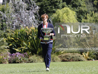 Jannik Sinner of Italy is posing with the Norman Brookes Challenge Cup after winning the 2024 Australian Open Final at the Royal Botanic Gar...