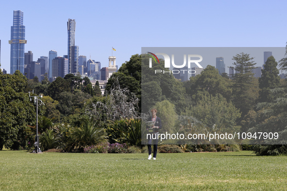 Jannik Sinner of Italy is posing with the Norman Brookes Challenge Cup after winning the 2024 Australian Open Final at the Royal Botanic Gar...