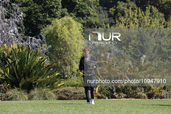 Jannik Sinner of Italy is posing with the Norman Brookes Challenge Cup after winning the 2024 Australian Open Final at the Royal Botanic Gar...