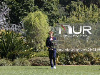 Jannik Sinner of Italy is posing with the Norman Brookes Challenge Cup after winning the 2024 Australian Open Final at the Royal Botanic Gar...