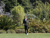 Jannik Sinner of Italy is posing with the Norman Brookes Challenge Cup after winning the 2024 Australian Open Final at the Royal Botanic Gar...