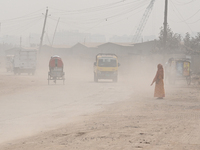 People Make Their Move In A Dusty Busy Road In Dhaka City, Bangladesh, On January 30, 2024. Dhaka City's Air Was Classified As 'very Unhealt...