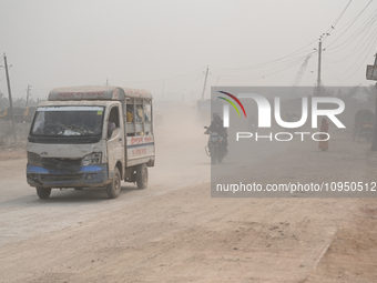 People Make Their Move In A Dusty Busy Road In Dhaka City, Bangladesh, On January 30, 2024. Dhaka City's Air Was Classified As 'very Unhealt...