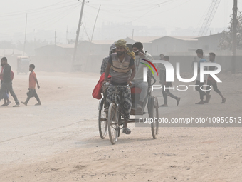 People Make Their Move In A Dusty Busy Road In Dhaka City, Bangladesh, On January 30, 2024. Dhaka City's Air Was Classified As 'very Unhealt...