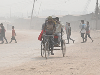 People Make Their Move In A Dusty Busy Road In Dhaka City, Bangladesh, On January 30, 2024. Dhaka City's Air Was Classified As 'very Unhealt...